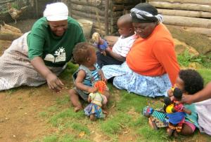 Grannies (gogos) at play with the c hildren in their care